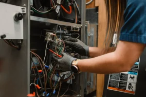 HVAC contractor performing a furnace repair in Maple Grove, MN